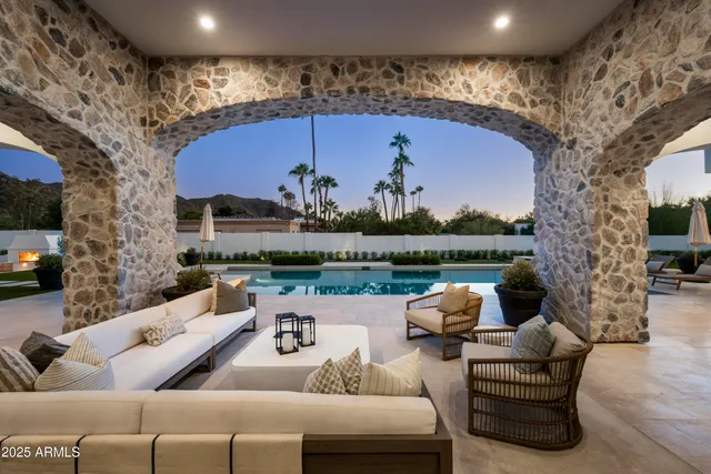 a front view of a house with a garden and plants