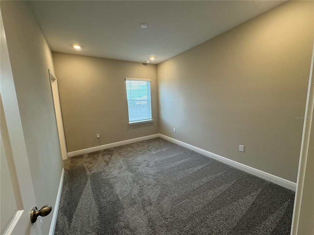 16434 Hamlin Hills Road Winter Garden, FL 34787 - Photo 23 of 50 an empty room with windows