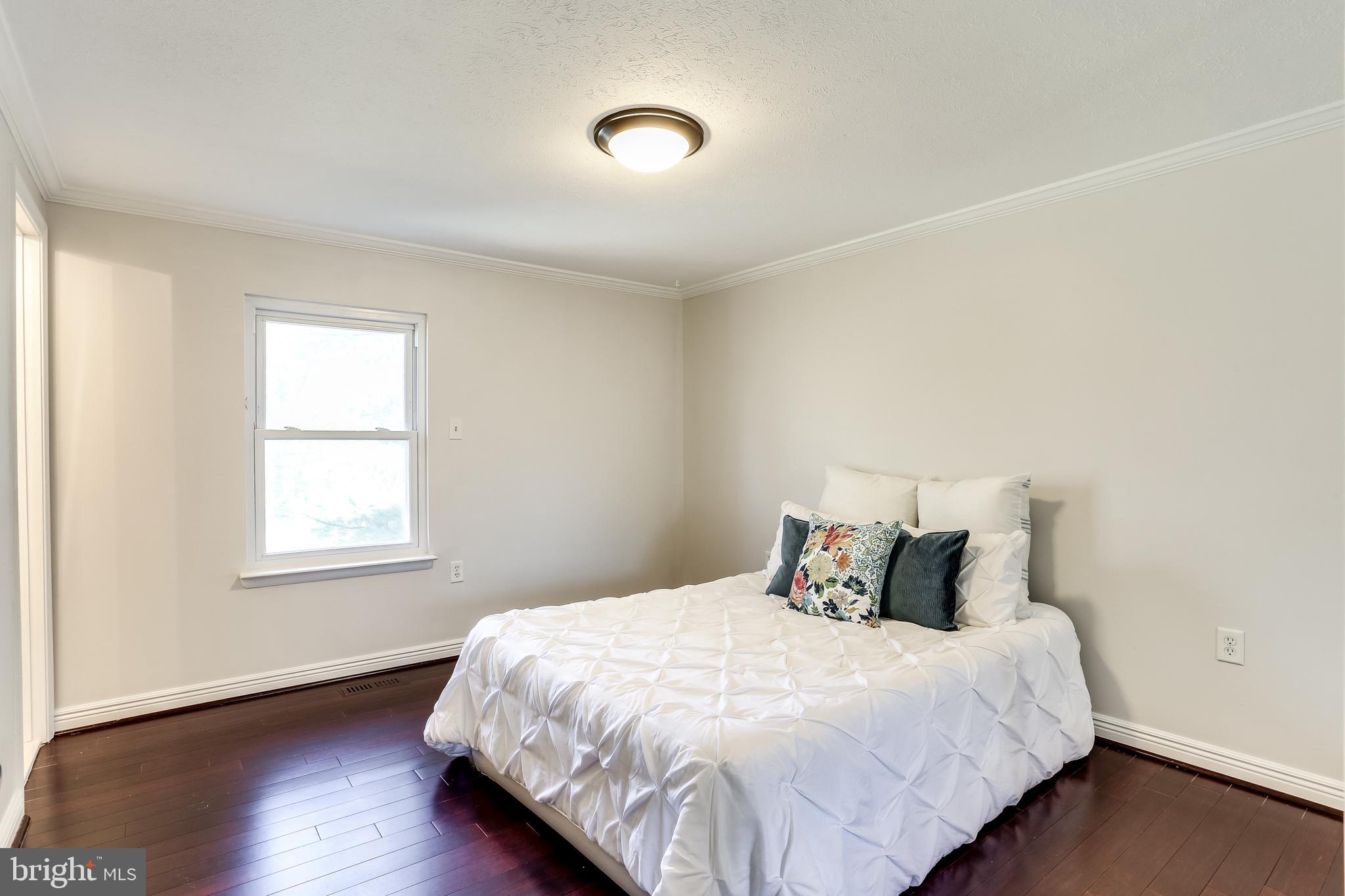 7843 Metacomet Road Hanover, MD 21076 - Photo 11 of 33 Master bedroom with beautiful wood floors.