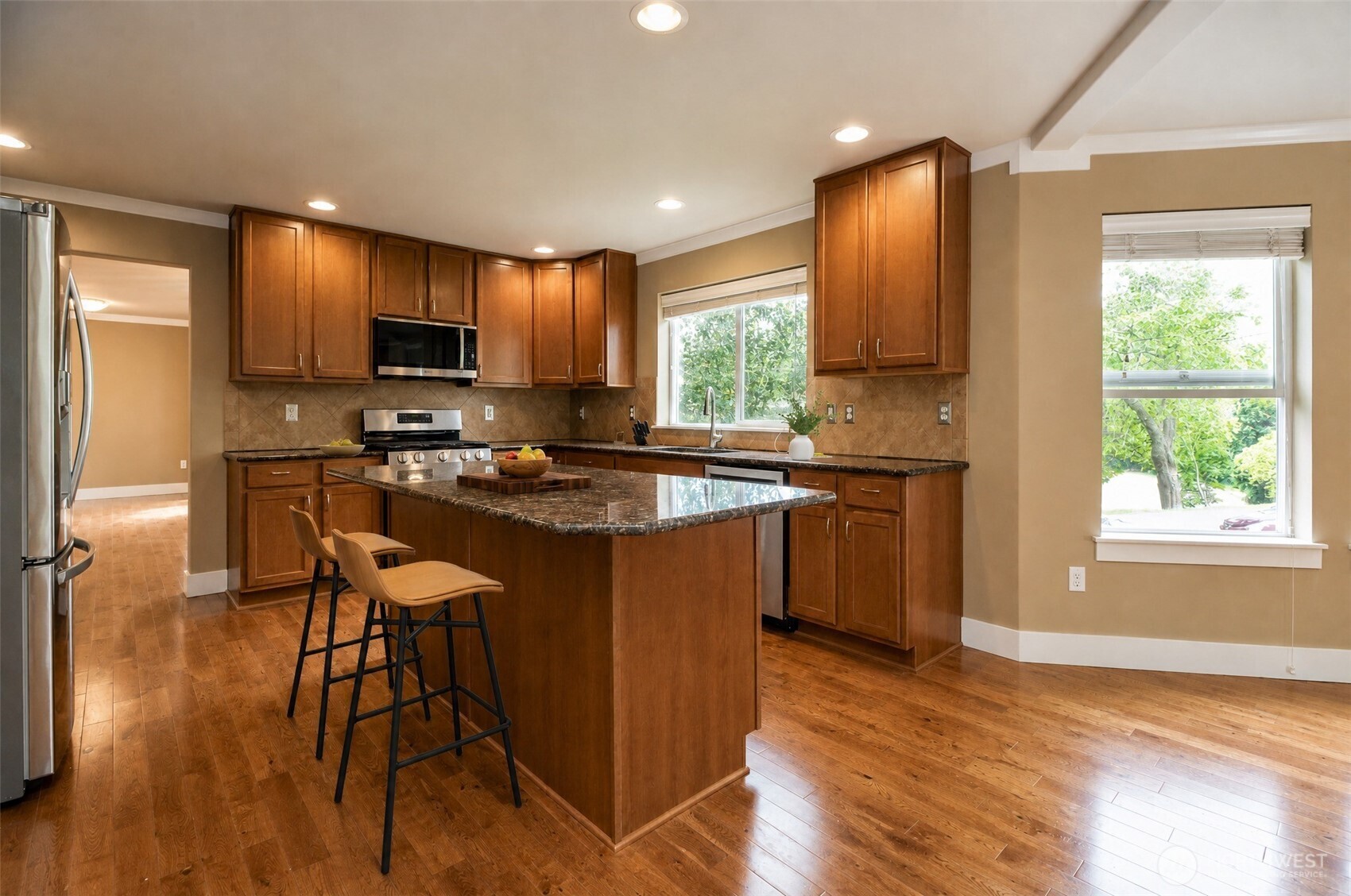 3000 South Mt Baker Boulevard Seattle, WA 98144 - Photo 14 of 40 a kitchen with stainless steel appliances granite countertop sink stove top oven and cabinets
