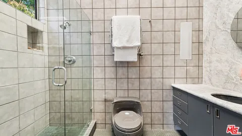 a bathroom with a toilet and a sink