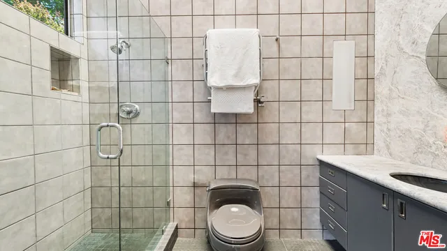 a bathroom with a toilet and a sink