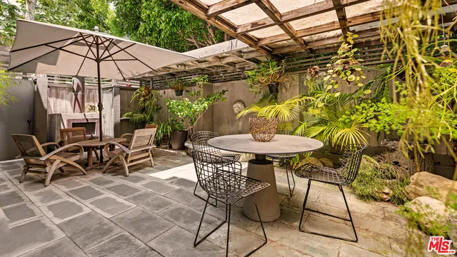 a table and chairs in a patio