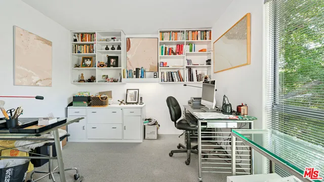 a work room with furniture and a window