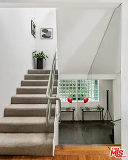 a living room with furniture and white walls
