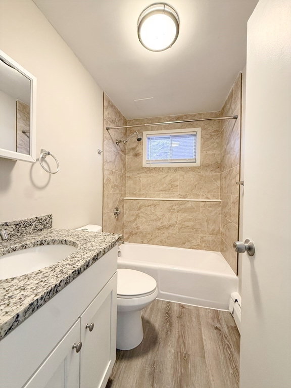 5 Meisner Circle, Unit 25 Salem, NH 03079 - Photo 3 of 6 a bathroom with a granite countertop sink toilet and shower