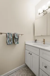 a bathroom with a sink and a mirror