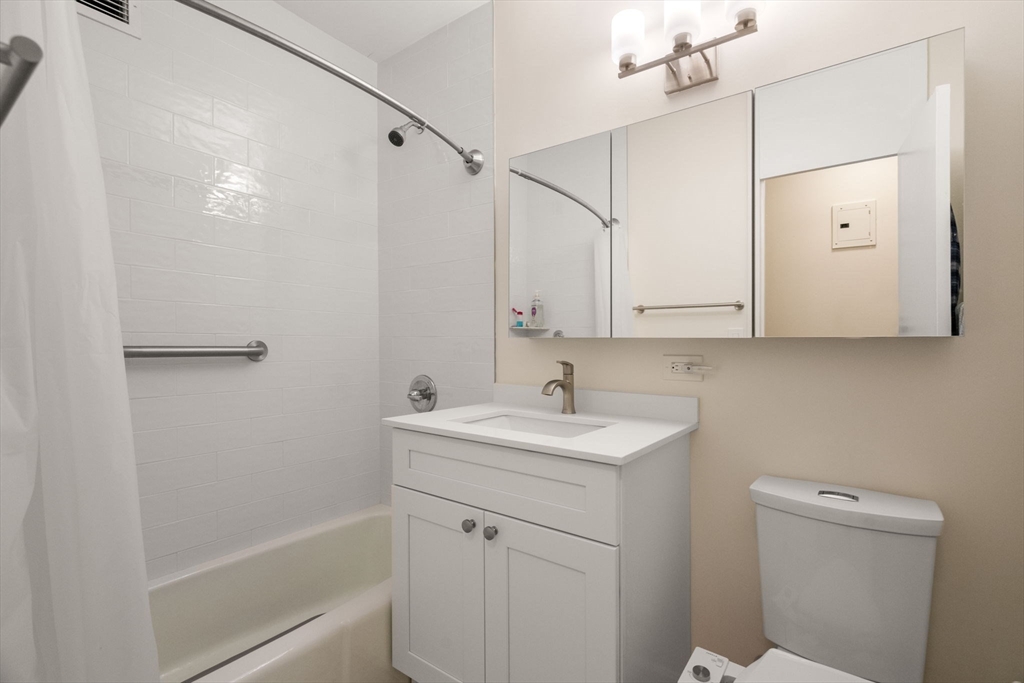 85 East India Row, Unit 36G Boston, MA 02110 - Photo 22 of 29 a bathroom with a sink a toilet and shower
