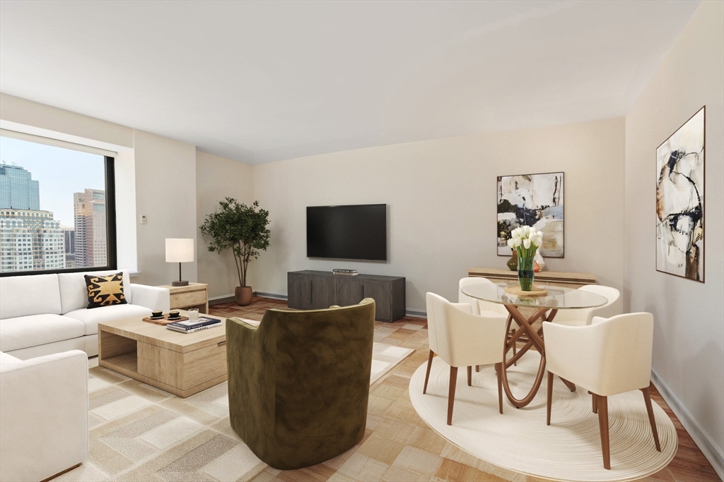 85 East India Row, Unit 36G Boston, MA 02110 - Photo 5 of 29 a living room with furniture and a flat screen tv