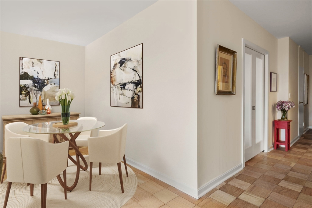 85 East India Row, Unit 36G Boston, MA 02110 - Photo 7 of 29 a view of a livingroom with furniture and a window