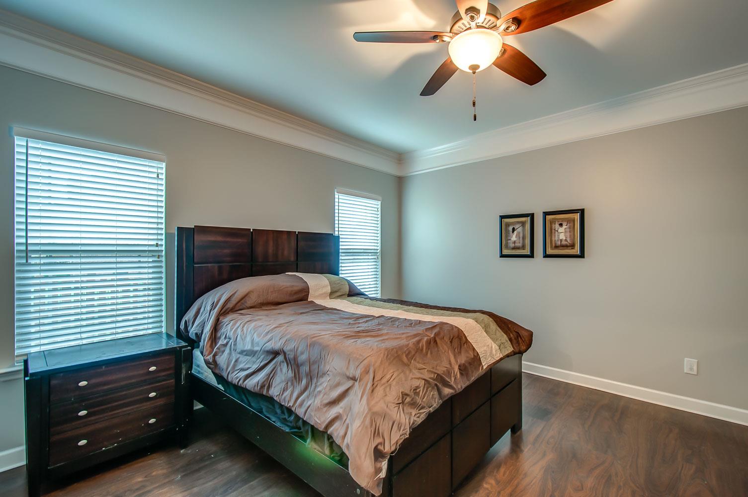 239 Abbey Road Lebanon, TN 37090 - Photo 12 of 25 a bedroom with a bed and a chandelier