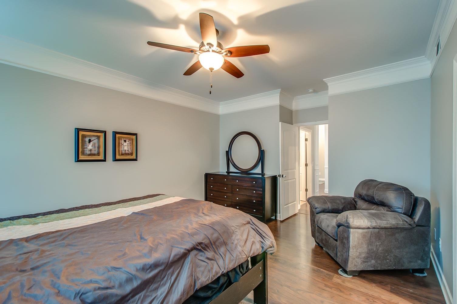 239 Abbey Road Lebanon, TN 37090 - Photo 13 of 25 a bedroom with a bed and a chandelier