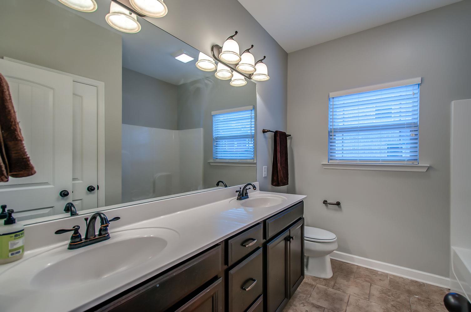 239 Abbey Road Lebanon, TN 37090 - Photo 19 of 25 a bathroom with a double vanity sink and a mirror