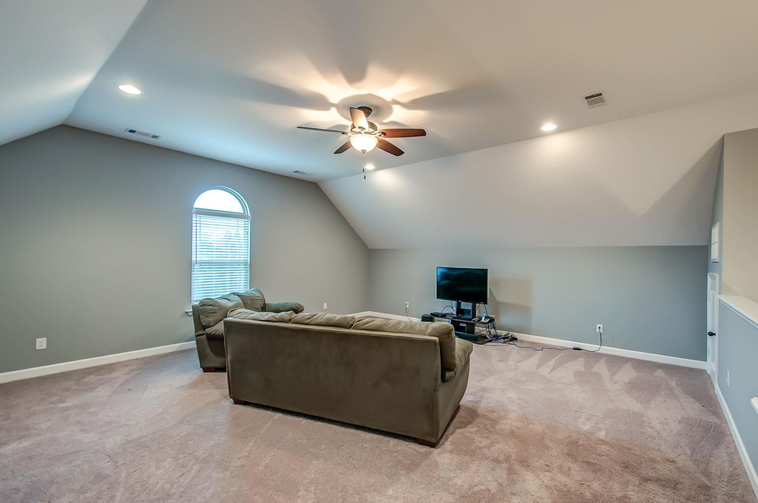 239 Abbey Road Lebanon, TN 37090 - Photo 20 of 25 a living room with furniture and a ceiling fan