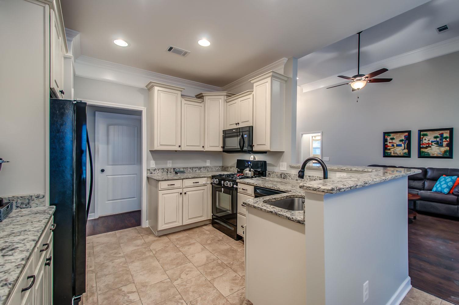 239 Abbey Road Lebanon, TN 37090 - Photo 7 of 25 a kitchen with stainless steel appliances granite countertop a sink stove and refrigerator
