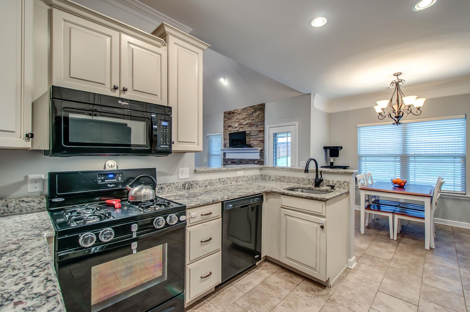 239 Abbey Road Lebanon, TN 37090 - Photo 9 of 25 a kitchen with stainless steel appliances a stove sink microwave and cabinets