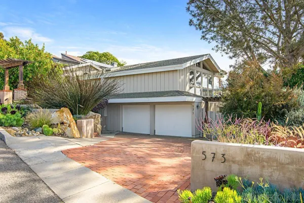 a front view of a house with a garage