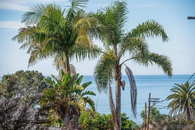 a bathroom with a shower a toilet and a sink
