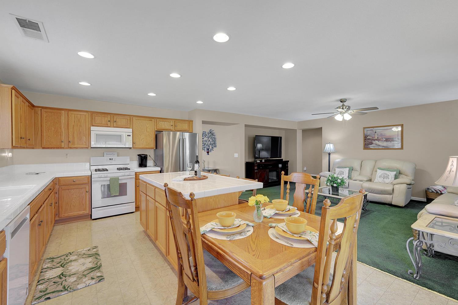 9840 Ellis Way Live Oak, CA 95953 - Photo 21 of 44 a large kitchen with a table and chairs