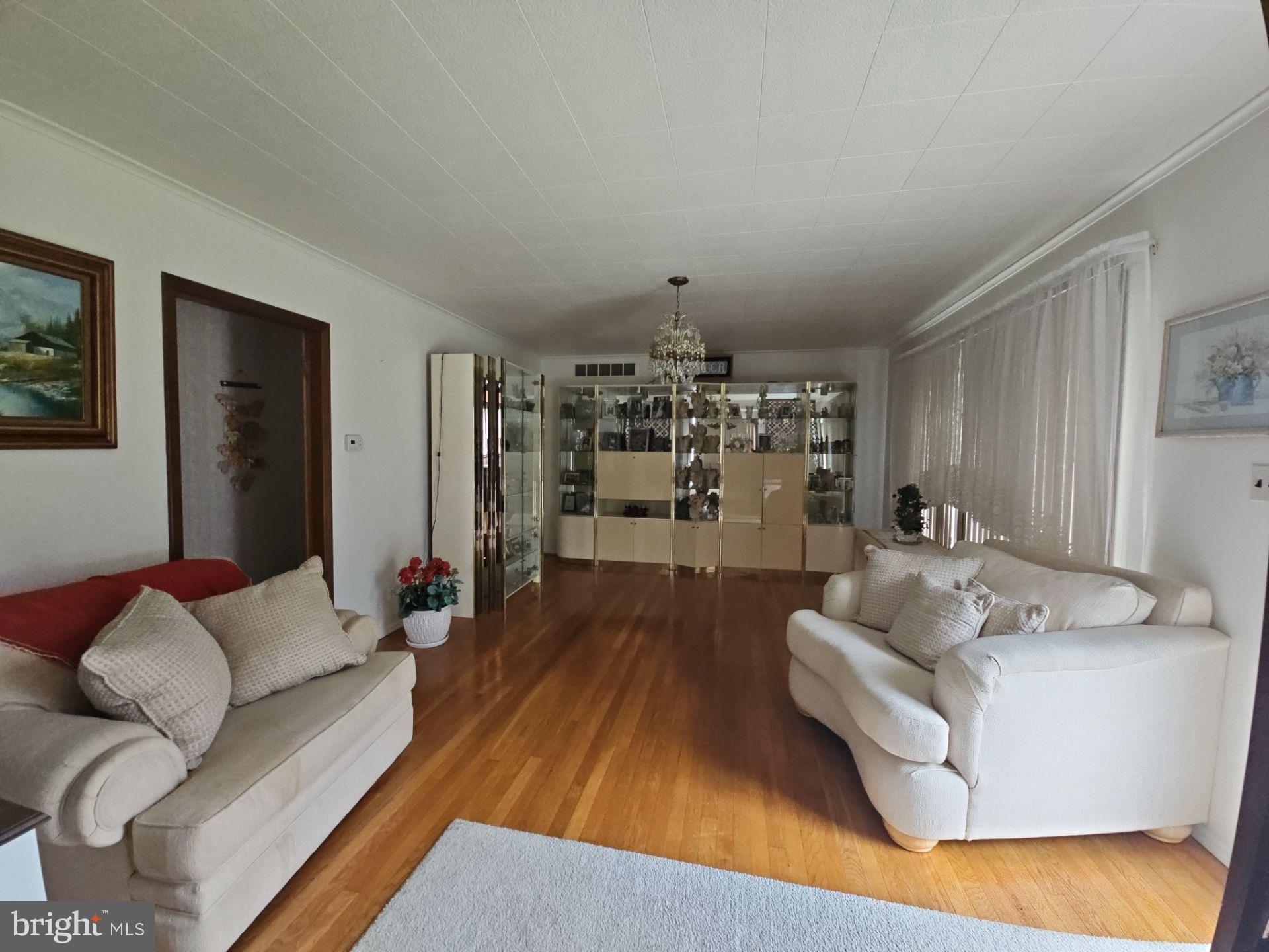 282 Woodruff Road Bridgeton, NJ 08302 - Photo 3 of 19 a living room with furniture and wooden floor