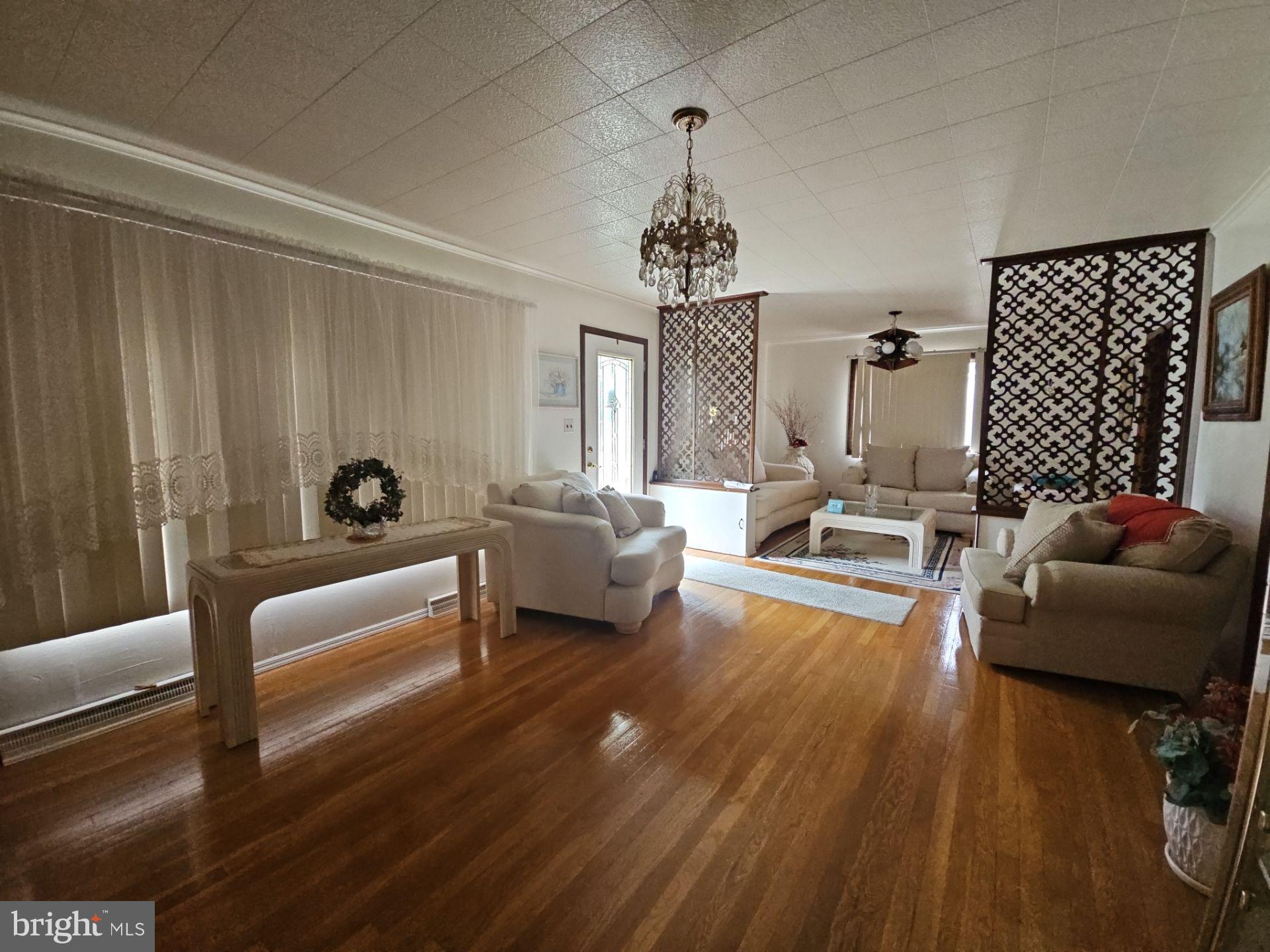 282 Woodruff Road Bridgeton, NJ 08302 - Photo 4 of 19 a living room with furniture and wooden floor