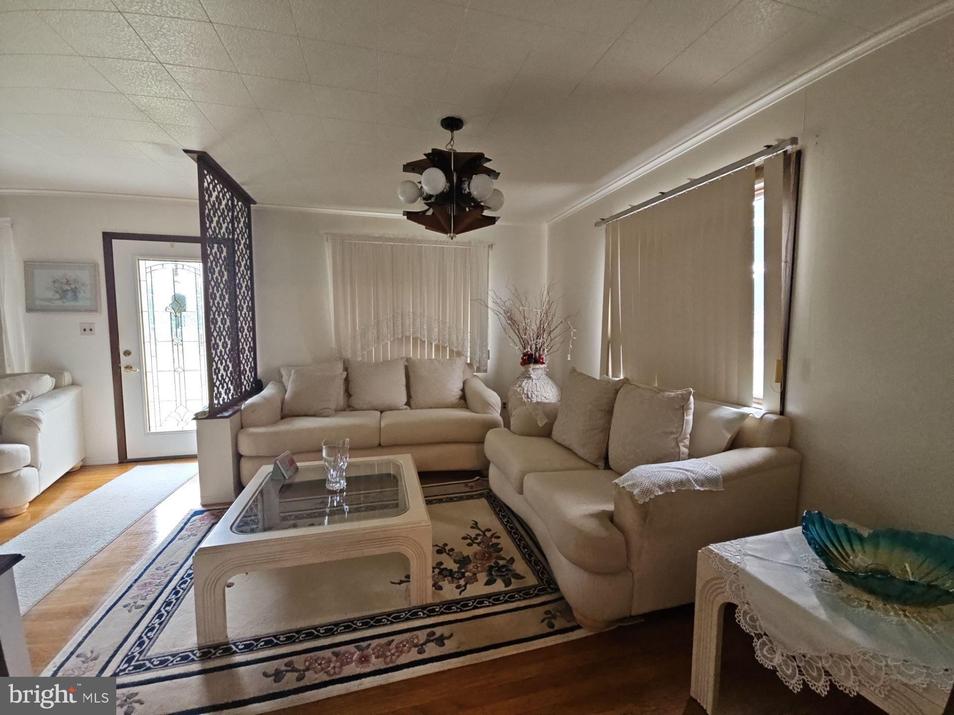 282 Woodruff Road Bridgeton, NJ 08302 - Photo 5 of 19 a living room with furniture and a chandelier