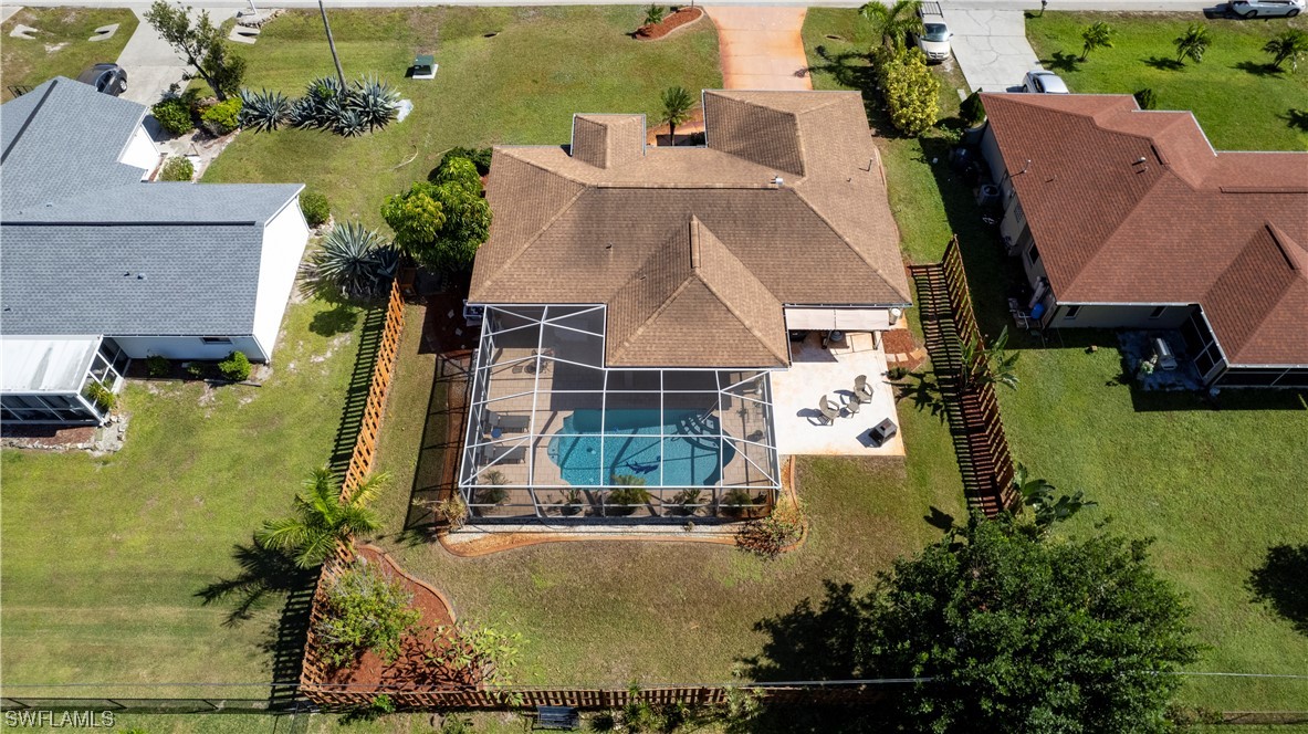 18222 Hepatica Road Fort Myers, FL 33967 - Photo 33 of 34 an aerial view of a house with swimming pool and large trees