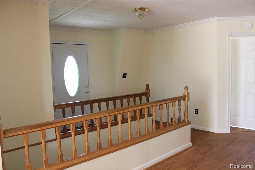 13201 South New Lothrop Road Byron, MI 48418 - Photo 10 of 32 Front entrance and stairs to lower level