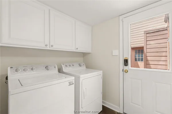 a view of storage and utility room with washer and dryer