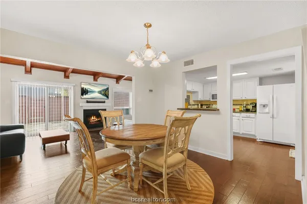 a dining room with furniture and window
