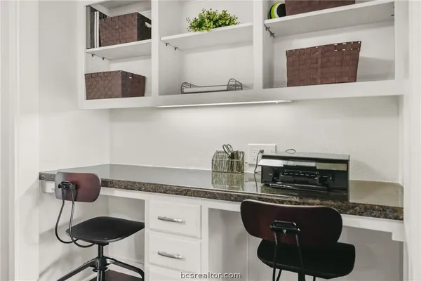 a kitchen with stainless steel appliances granite countertop a stove and a microwave