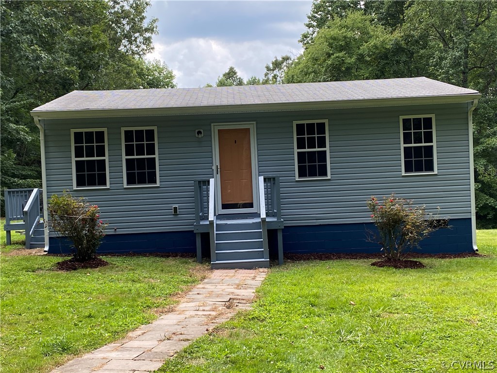 3524 Forest Grove Road Sandy Hook, VA 23153 - Photo 1 of 18 a front view of a house with garden