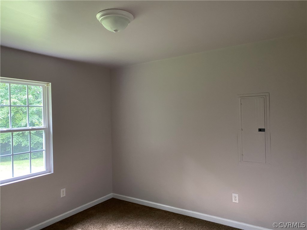 3524 Forest Grove Road Sandy Hook, VA 23153 - Photo 12 of 18 an empty room with a window