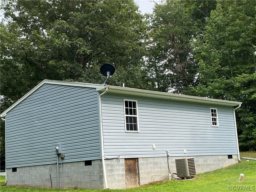 3524 Forest Grove Road Sandy Hook, VA 23153 - Photo 15 of 18 a view of a house with a backyard
