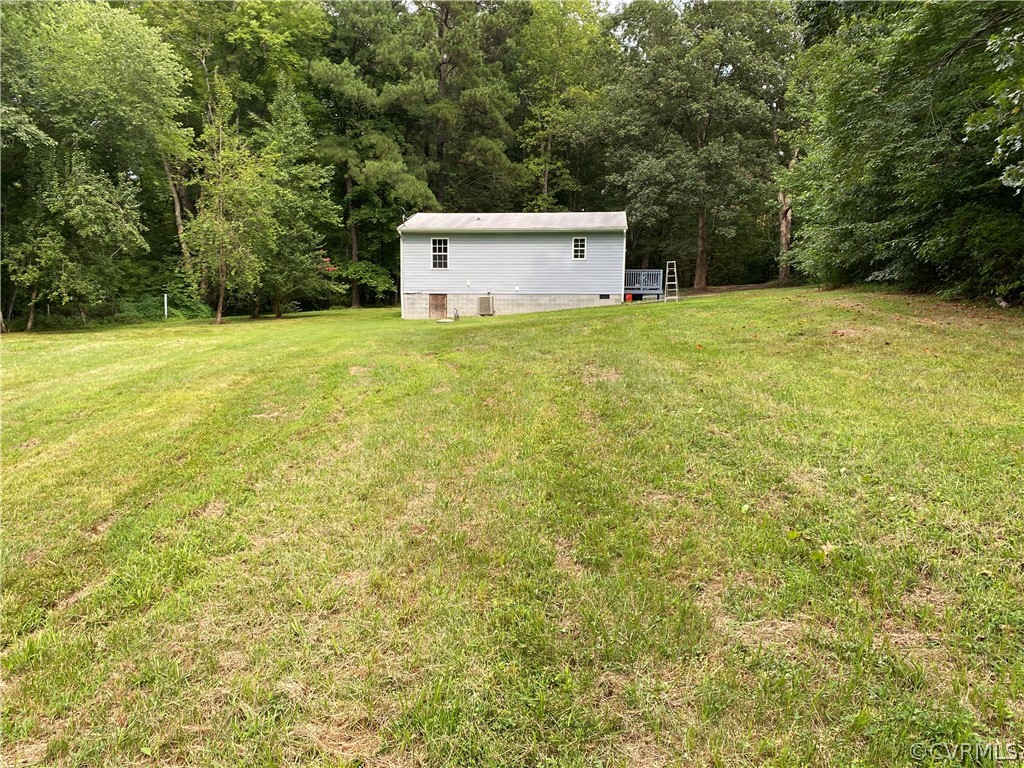 3524 Forest Grove Road Sandy Hook, VA 23153 - Photo 17 of 18 a view of a house with a yard