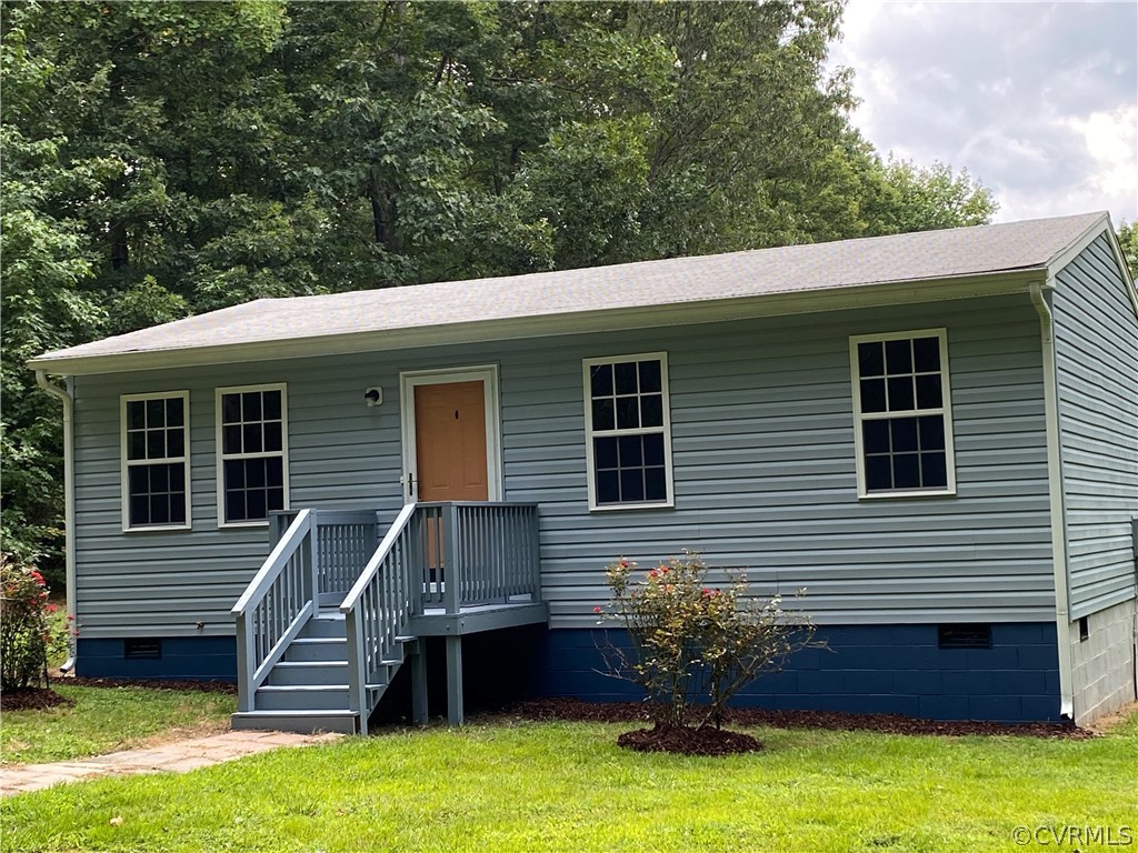 3524 Forest Grove Road Sandy Hook, VA 23153 - Photo 2 of 18 a front view of a house with yard
