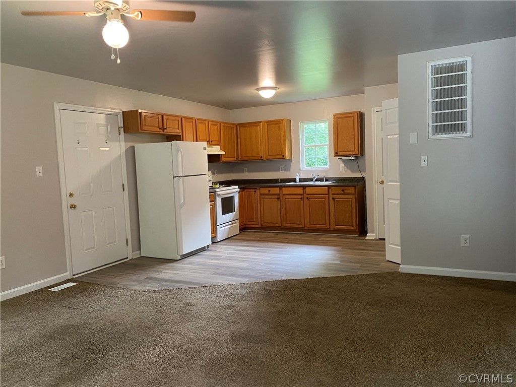 3524 Forest Grove Road Sandy Hook, VA 23153 - Photo 6 of 18 a kitchen with refrigerator and microwave