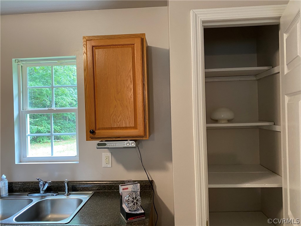 3524 Forest Grove Road Sandy Hook, VA 23153 - Photo 7 of 18 a room with a window and storage space