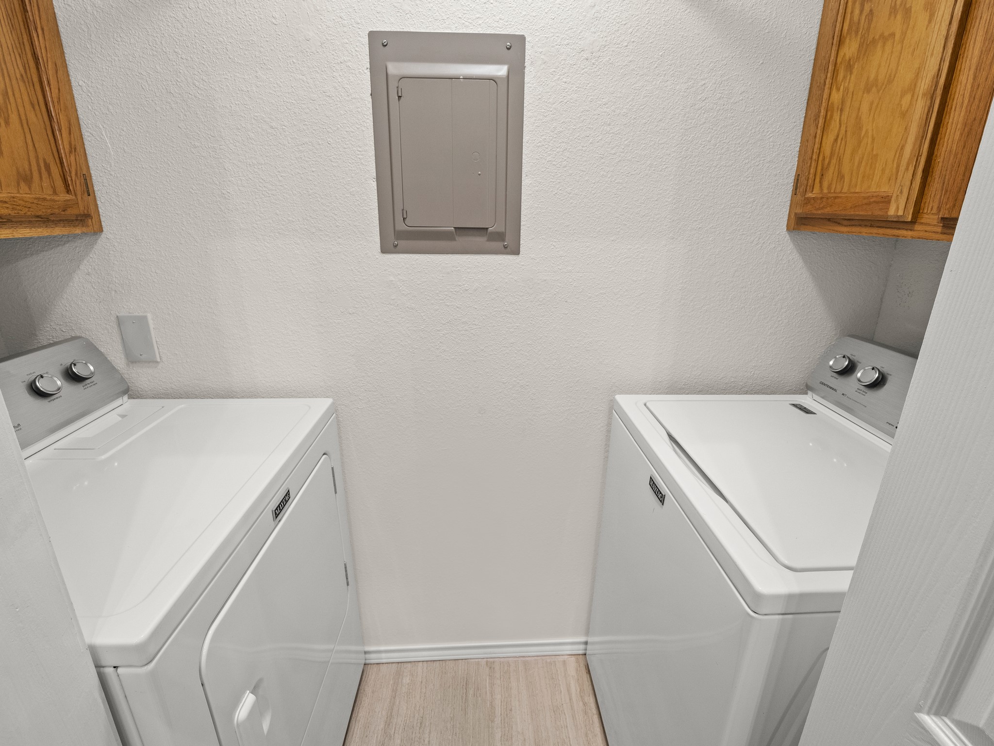 3809 Spicewood Springs Road, Unit 137 Austin, TX 78759 - Photo 23 of 34 Functional laundry space featuring modern appliances and convenient overhead cabinetry.