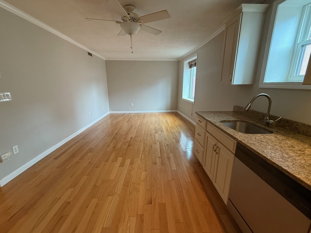 90 Salem Street, Unit 4R Boston, MA 02113 - Photo 2 of 6 a kitchen with a sink and wooden floor