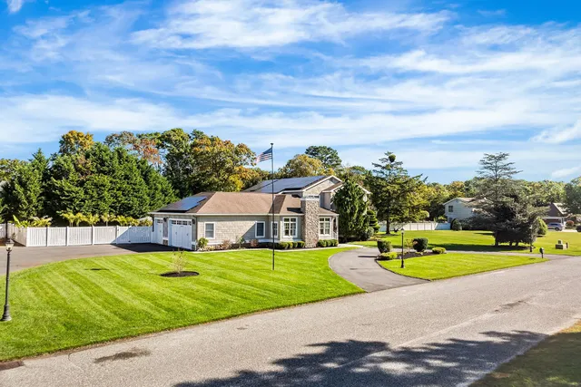 a view of swimming pool with outdoor seating and yard