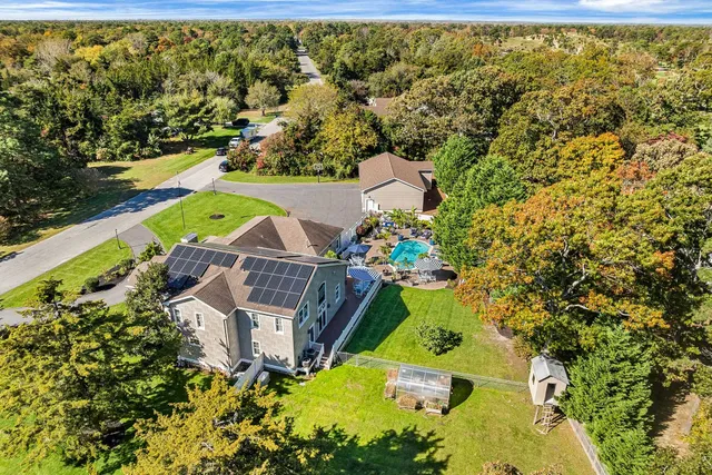 an aerial view of a house with a garden