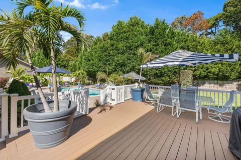 a view of balcony with outdoor seating and trees