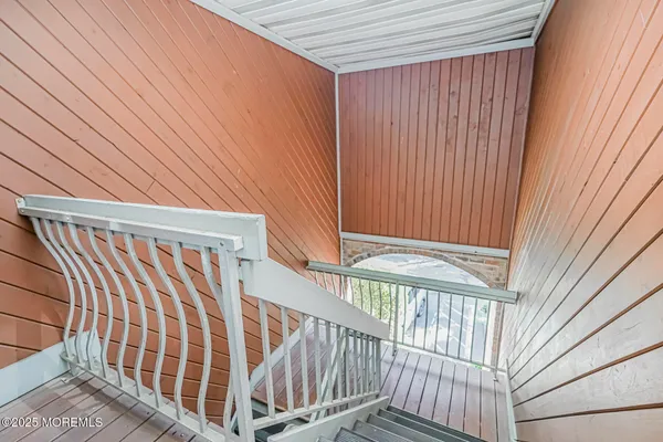 a view of a balcony with wooden floor