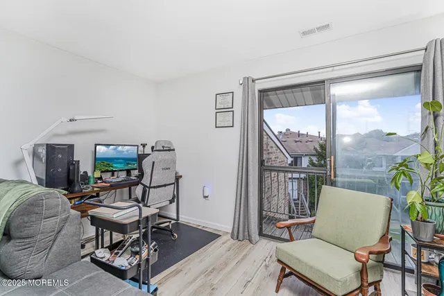 a work room with furniture and a window