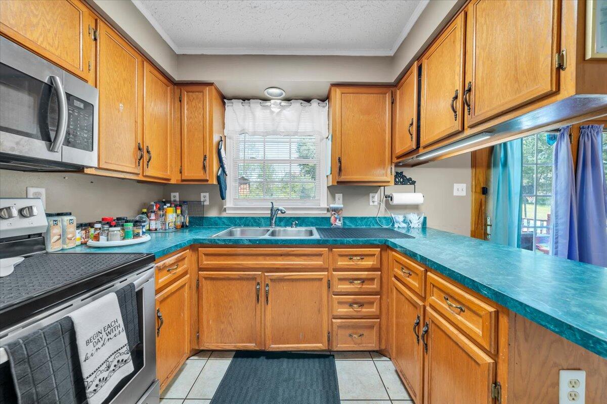 3870 Goose Dam Road Rocky Mount, VA 24151 - Photo 15 of 44 a kitchen with stainless steel appliances granite countertop a sink and cabinets