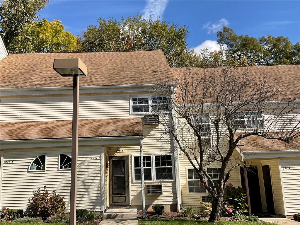 1271 Washington Street, Unit 5 Middletown, CT 06457 - Photo 18 of 19 a side view of a house with a street