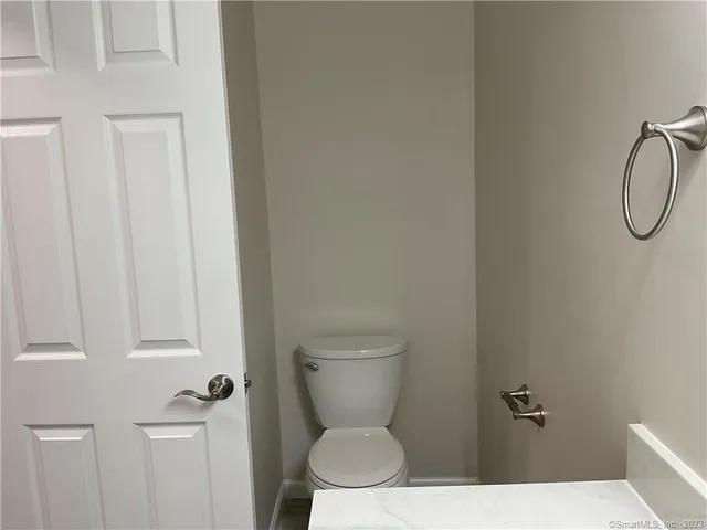 a bathroom with a toilet and a sink