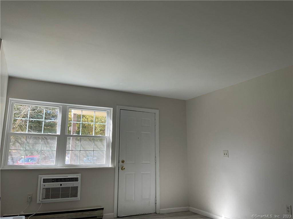1271 Washington Street, Unit 5 Middletown, CT 06457 - Photo 8 of 19 an empty room with windows