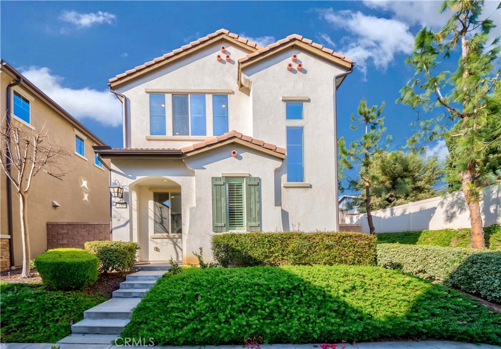 350 Lido Way Brea, CA 92821 - Photo 1 of 1 a view of a white house with potted plants and a large tree